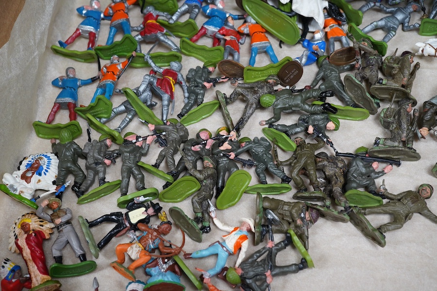 A quantity of Britains plastic soldiers; including Britains Deetail series, including; notes, infantry, native Americans, it Turkish Warriors, archers, WWII soldiers, etc. Condition - good